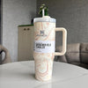 Stanley tumbler with marble design on a table