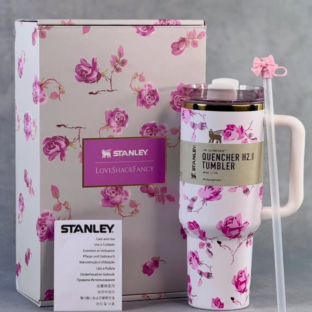 Stanley x LoveShackFancy limited edition tumbler on white fabric with romantic vintage floral detailing