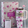 Stanley x LoveShackFancy limited edition tumbler on white fabric with romantic vintage floral detailing