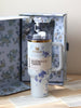 Stanley tumbler with floral design in a floral-patterned box on a wooden surface.