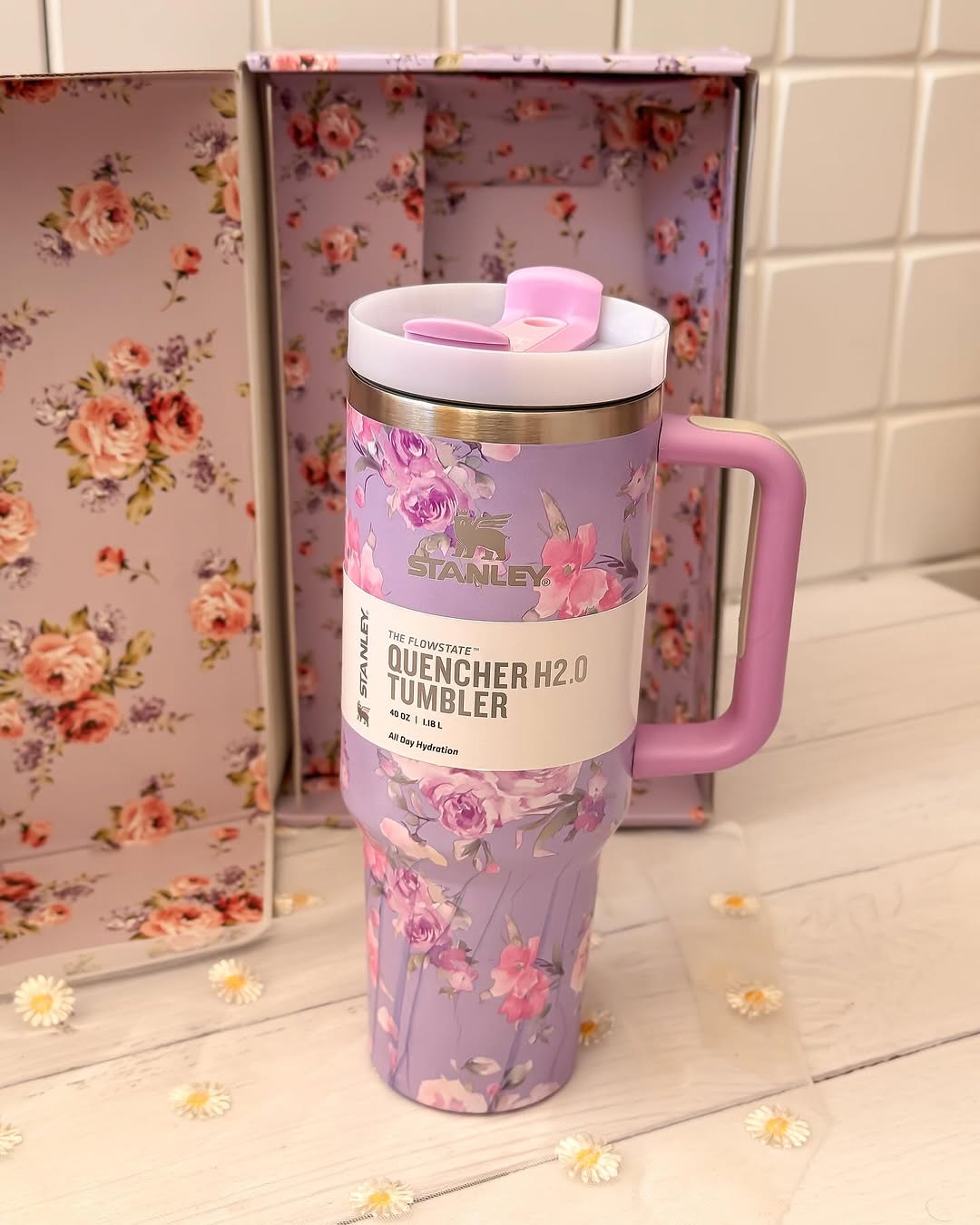 Stylish 40oz Stanley tumbler from LoveShackFancy with vintage-inspired floral design and steel straw, ideal for on-the-go hydration