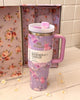 Stylish 40oz Stanley tumbler from LoveShackFancy with vintage-inspired floral design and steel straw, ideal for on-the-go hydration