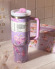 Stanley and LoveShackFancy collab tumbler placed on a pastel background, highlighting the elegant bow and floral lid