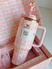 Top view of LoveShackFancy Stanley tumbler with soft pink floral lid and reusable steel straw, limited edition