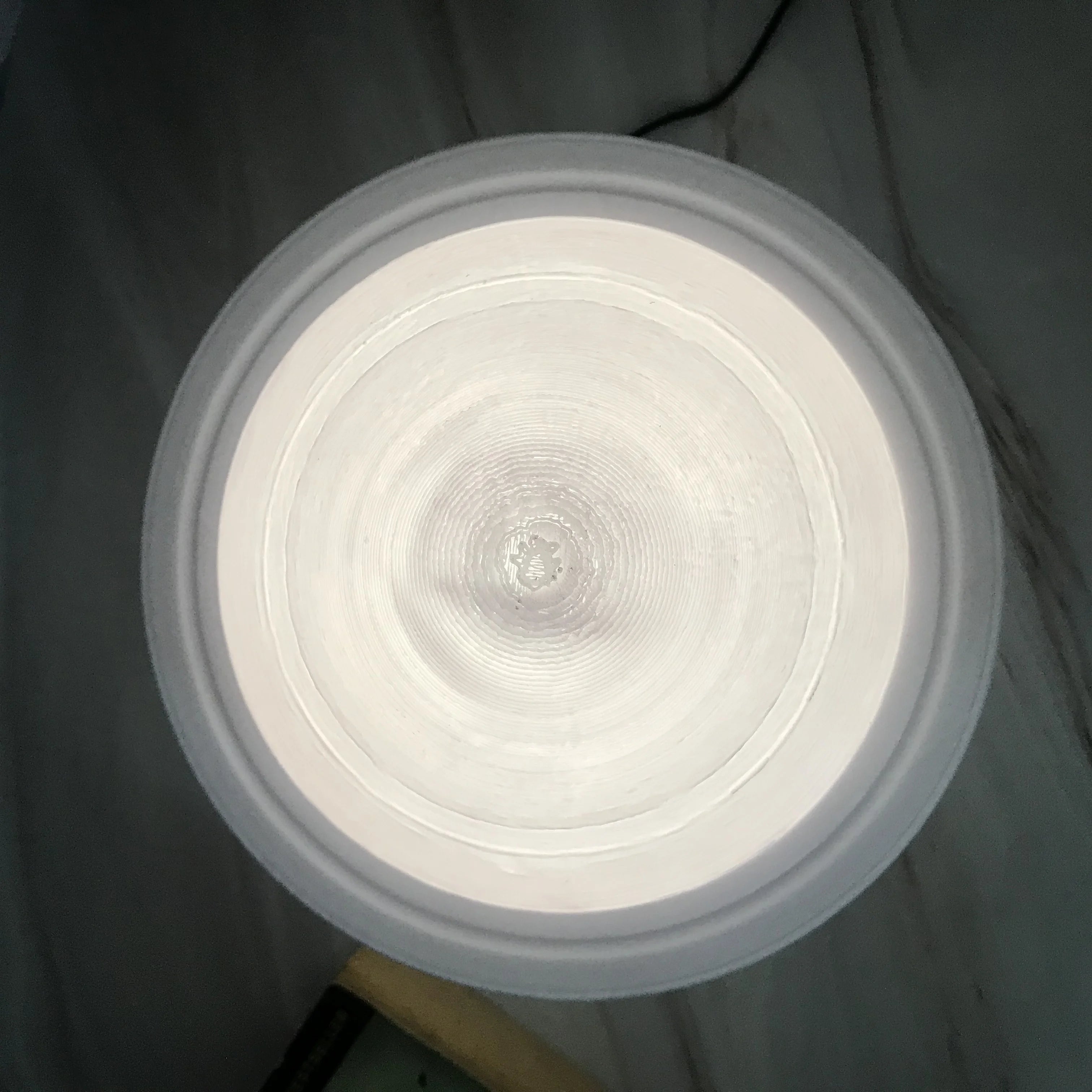 Saturn Lamp illuminated against a starry background