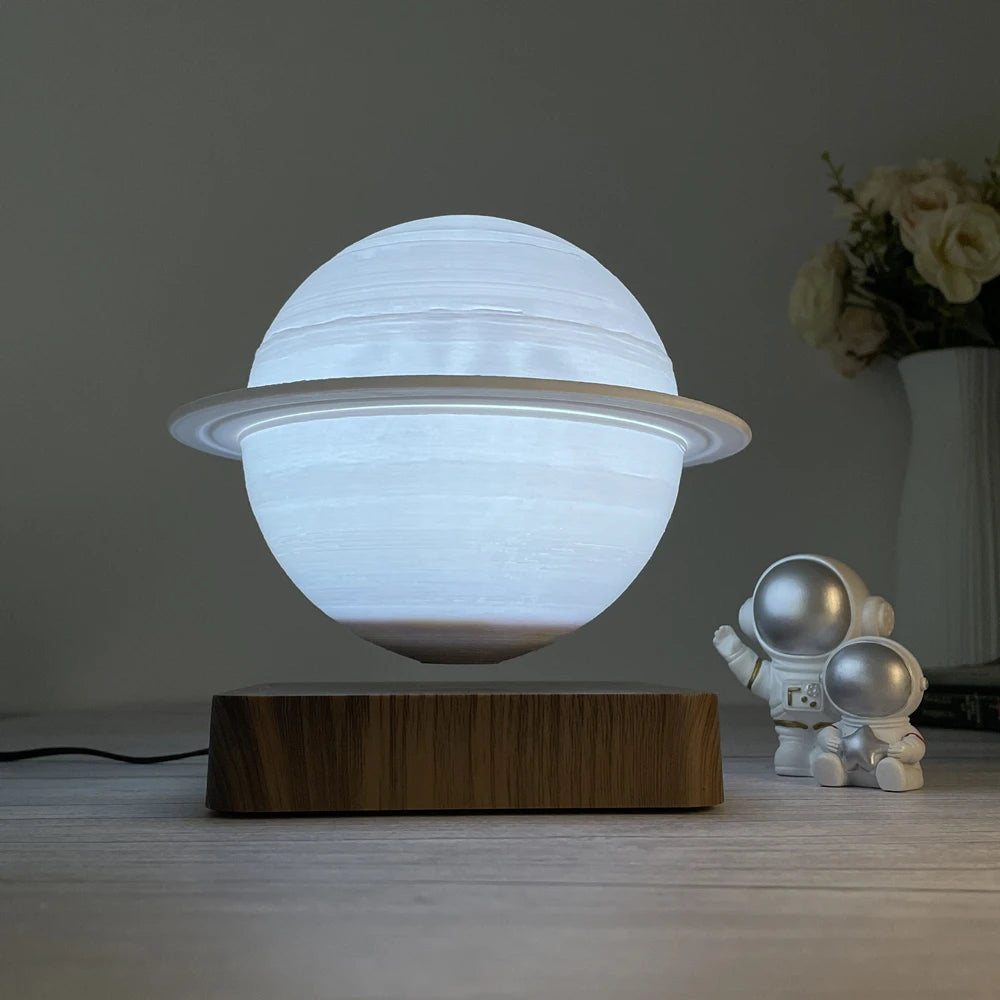 Side view of the Floating Saturn Lamp showing its magnetic levitation