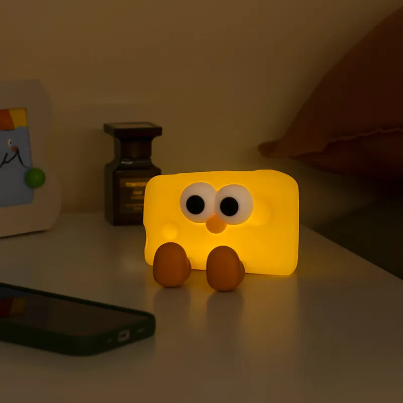 Side view of the cheese night light with adjustable brightness