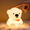 Cute Bear Silicone Night Light illuminating a bedroom with soft, colorful light