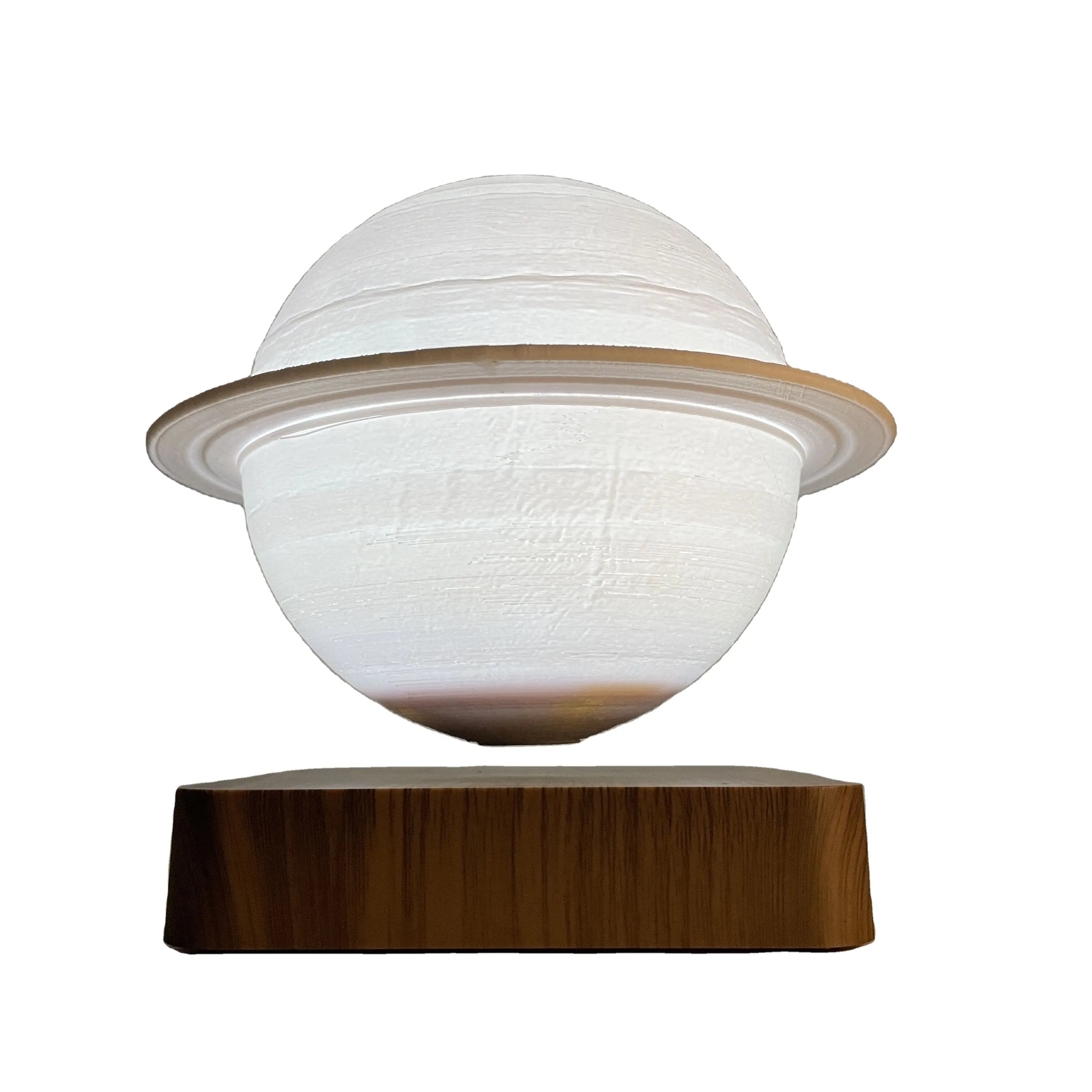 Saturn Lamp hovering elegantly above its magnetic base