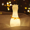 Giraffe with Scarf Silicone Night Light in white, showcasing its cute design and soft silicone material