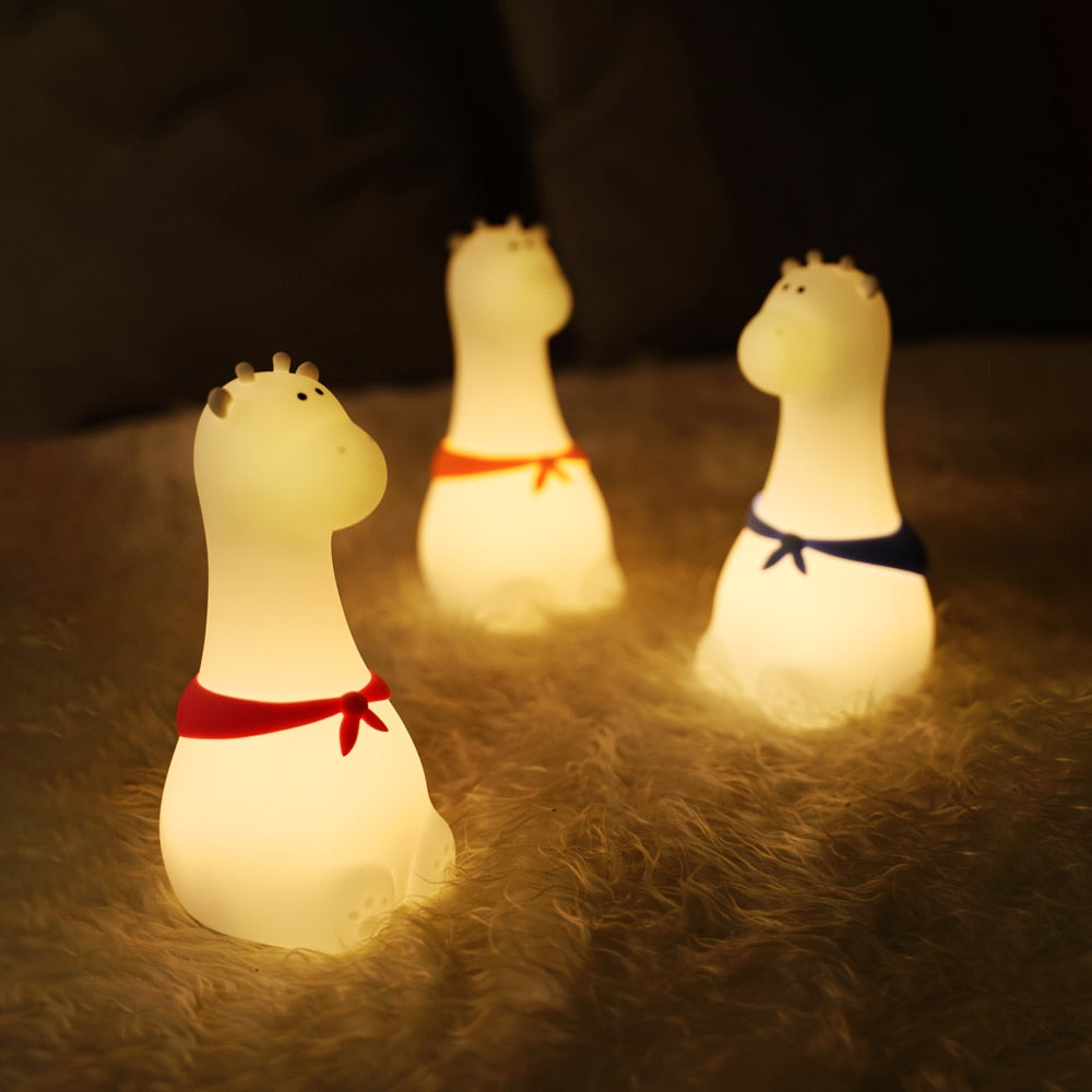 Giraffe silicone night light placed on a nightstand, perfect for bedside illumination.