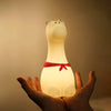 Close-up of the adorable scarf on the Giraffe silicone night light, adding a charming touch.