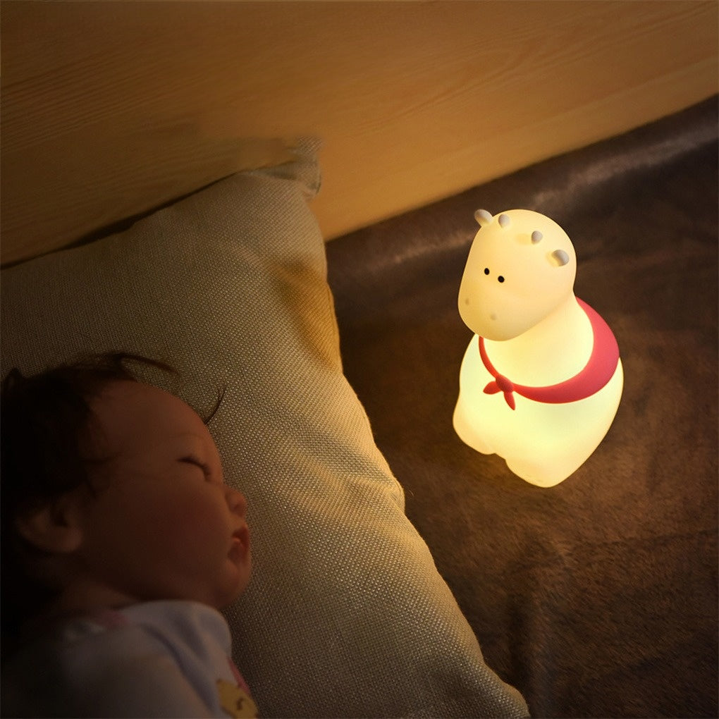 Giraffe with Scarf silicone night light placed in a kids’ bedroom, enhancing the cozy and playful atmosphere.