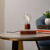 Palatial Levitating Magnetic Lamp illuminating a dark room, providing perfect mood lighting