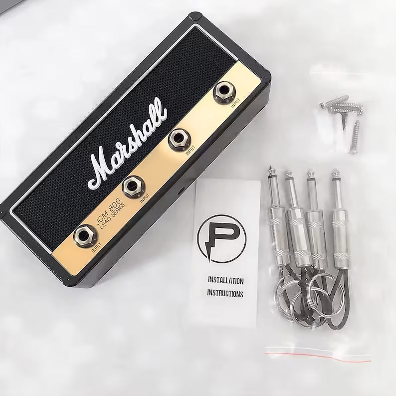 Marshall Jack Rack key holder with keys inserted: Demonstrating practical use, keys are easily inserted into the guitar plug keychains, adding convenience and flair to your key organization