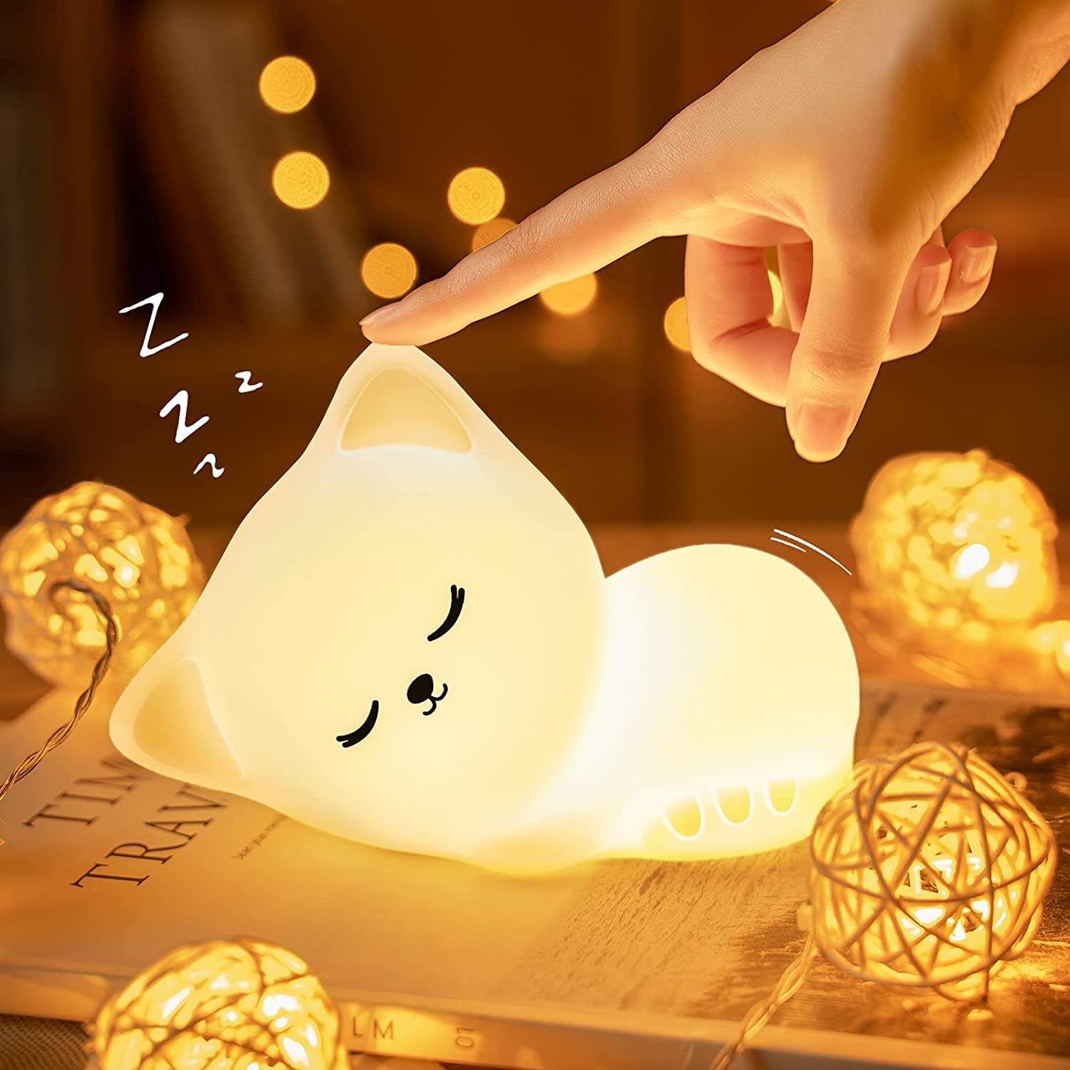 Cute cat night light glowing in pink.